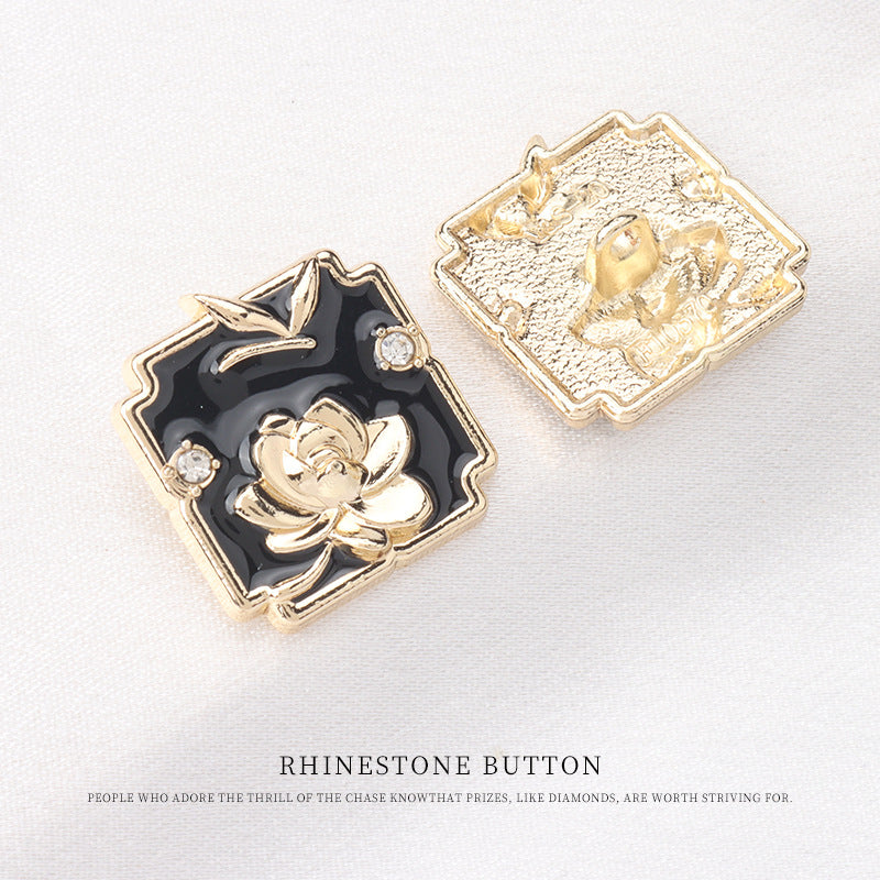Square shank button front in black enamel with gold lotus; backside gold-tone plating