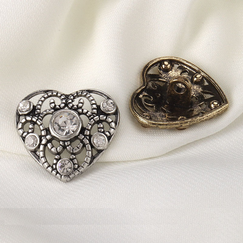 Heart-shaped rhinestone buttons: silver front and gold back plate with holes