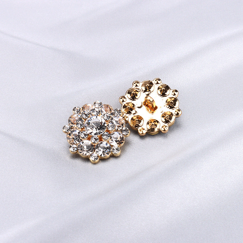 2 metal shank buttons: gold-tone with clear/white round rhinestones
