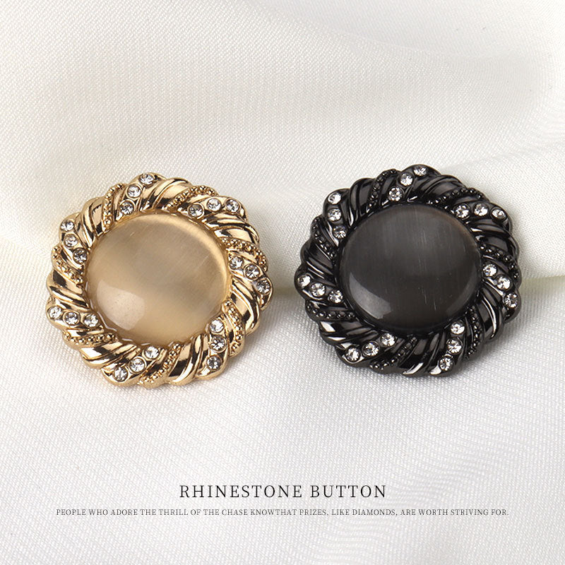 Rhinestone cat’s-eye buttons in gold and black, round metal frames with shanks