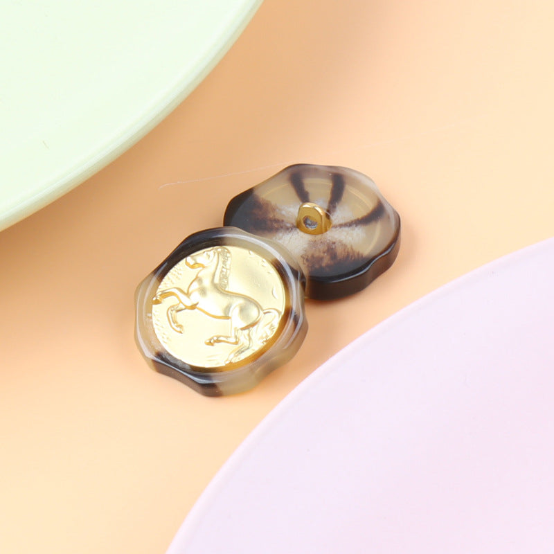 Gold-tone Roman horse figure metal shank button with clear resin-like top view