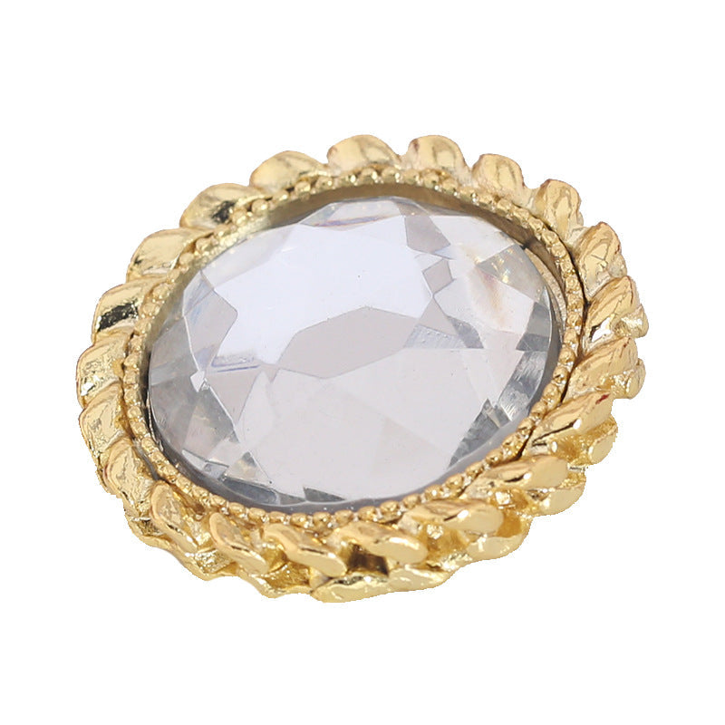 Gold metal rhinestone shank button, round crystal cabochon in ornate bezel.
