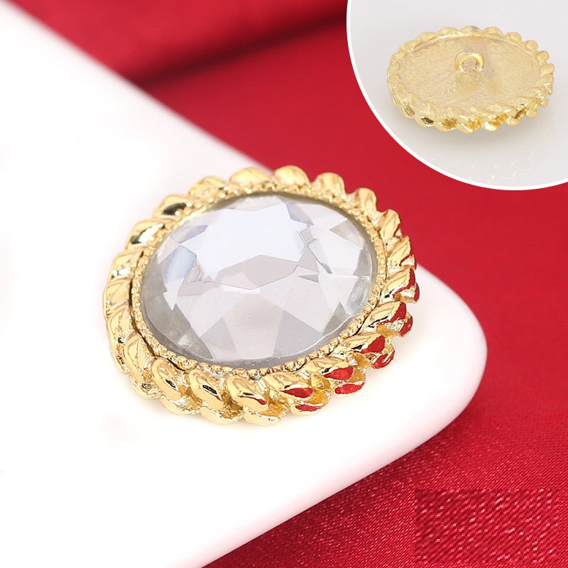 Gold rhinestone shank button: round crystal front and metal loop back shown.