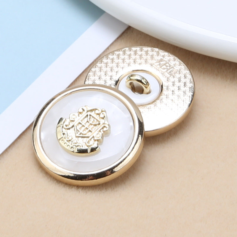 Round resin buttons with gold shank: white center anchor-shield emblem, patterned gold backs