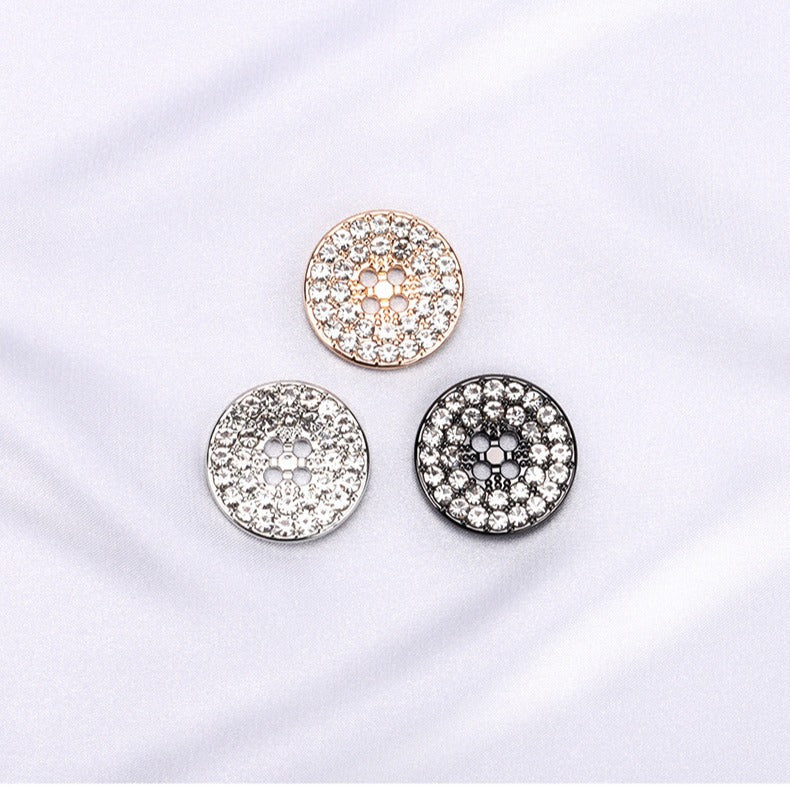 Set of round rhinestone four-hole buttons: gold, silver, and gunmetal tones