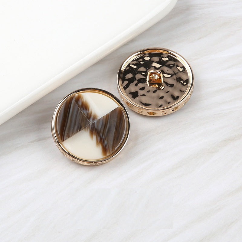 Fan-shaped two-tone resin buttons in dark brown marble and black speckled, metal shank
