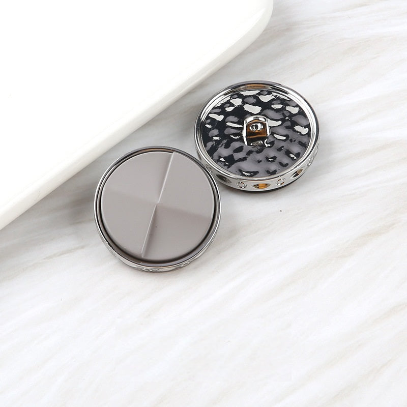 Fan-shaped two-tone resin buttons: light gray and black speckled, metal shank