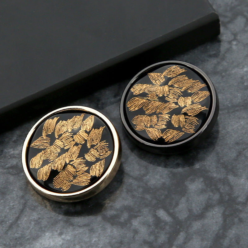 20mm round black buttons with gold floral pattern and shiny metal rim, two buttons