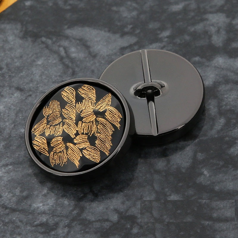 20mm round black button with gold floral design and metal loop shank