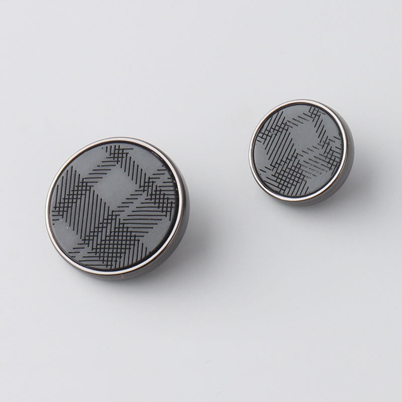 Round resin metal shank button front with laser-engraved geometric pattern, dark face