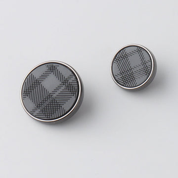 Round resin metal shank button front with laser-engraved geometric pattern, dark face
