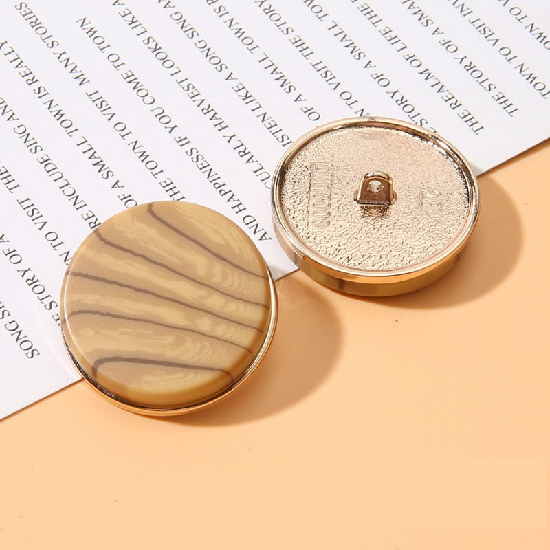Beige-brown marbled round resin shank button front and beige metal back