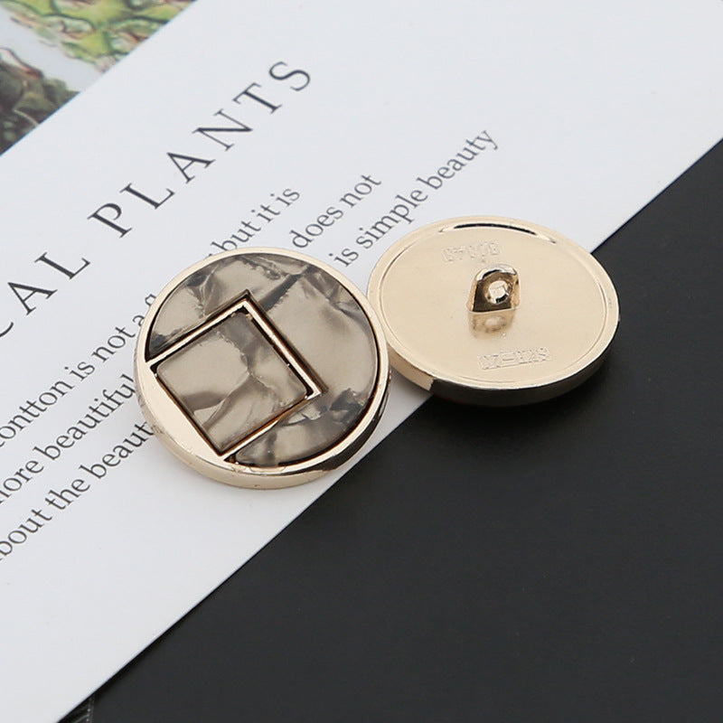Coffee-brown round shank buttons pair: front square resin inset and gold-tone back