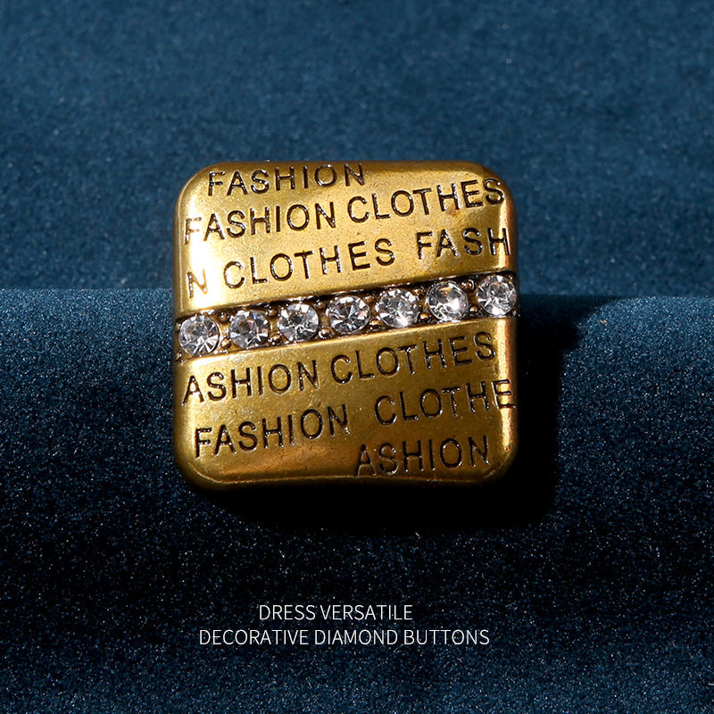 Square rhinestone button in gold, with a row of crystals across the center