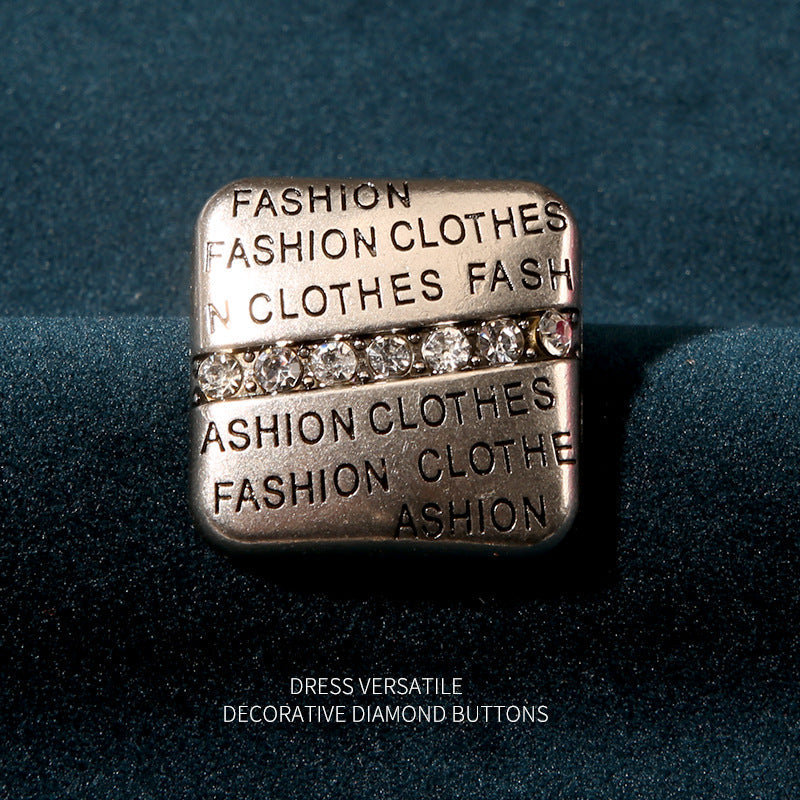 Square rhinestone button in silver, with a row of crystals across the center