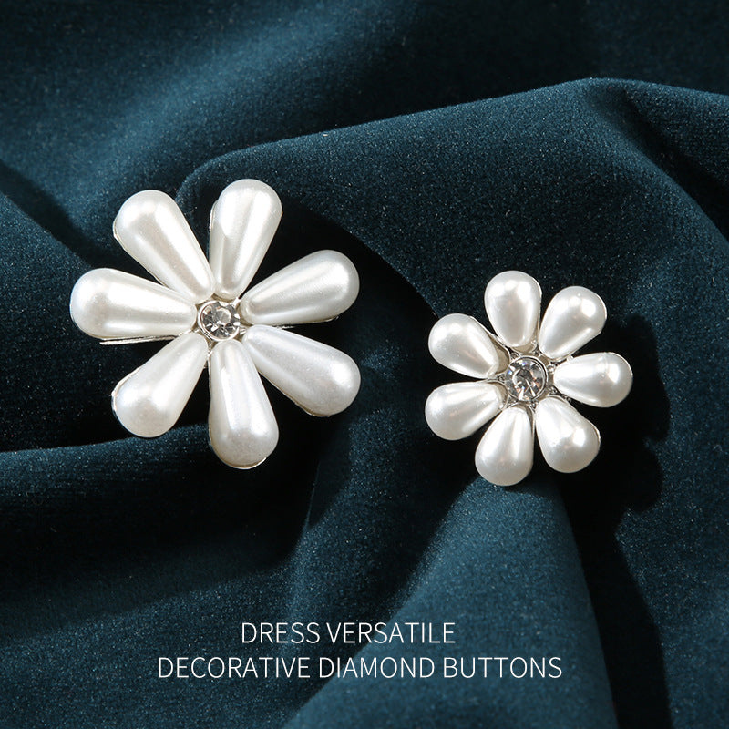 Two white pearl floral buttons with crystal center, silver-tone base, 23–32mm