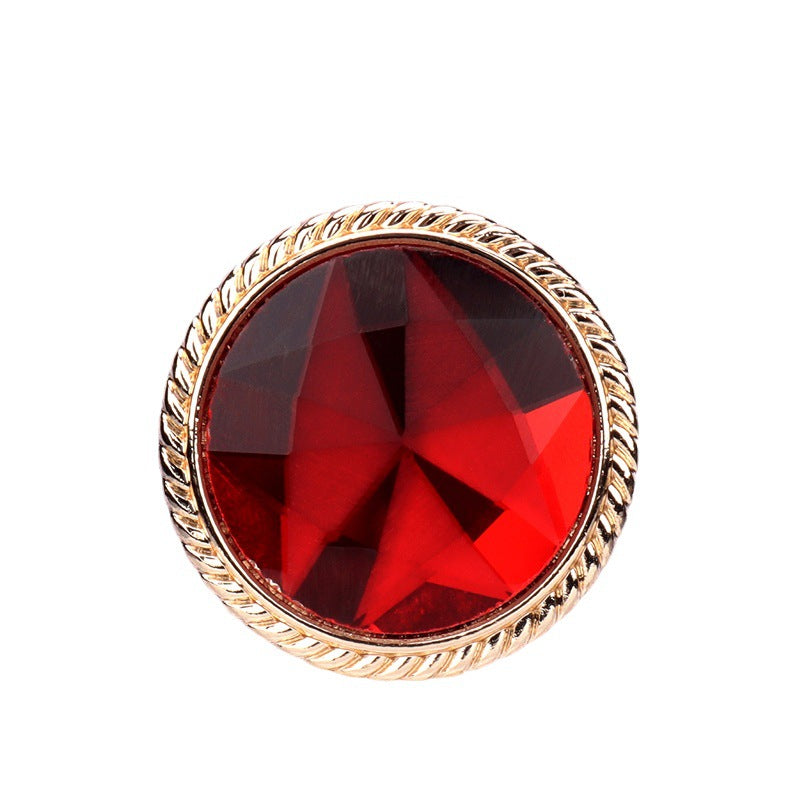 Colored glass button with gold metal shank, red faceted center, round 25mm