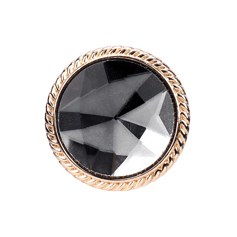 Colored glass button with gold metal shank, dark faceted center, round 25mm