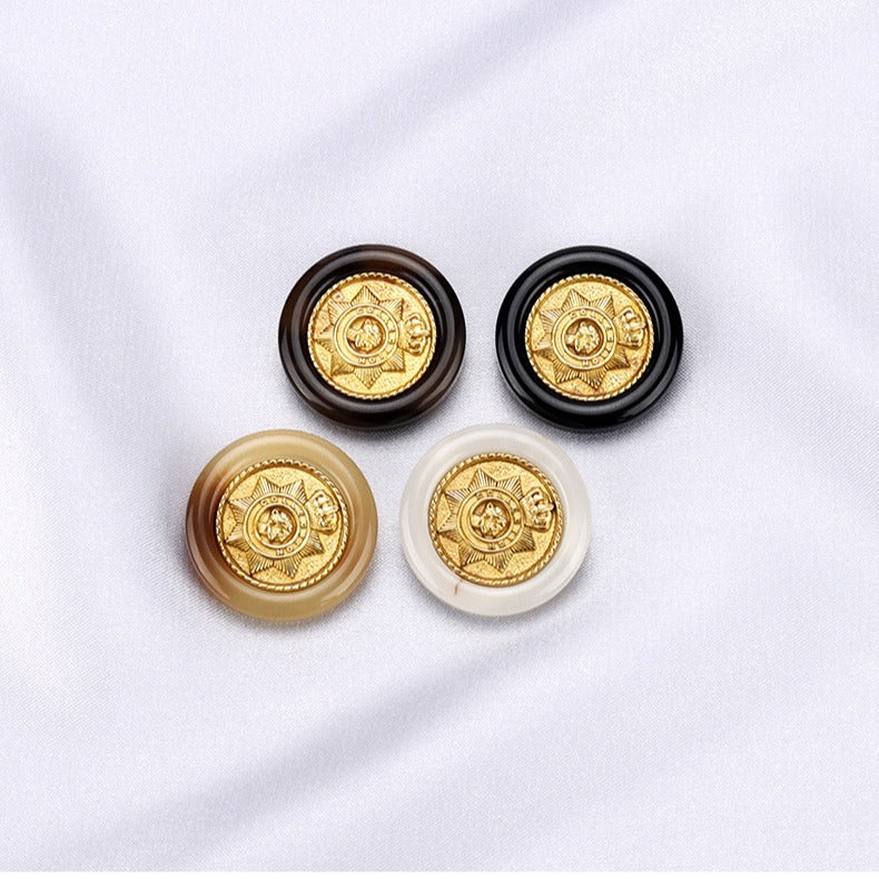 Set of round resin buttons: black, white, beige, and brown with gold crown crest
