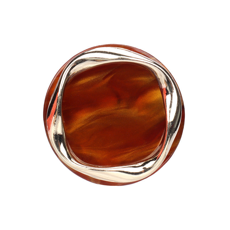 Red-brown resin shank button with silver metal rim, round front