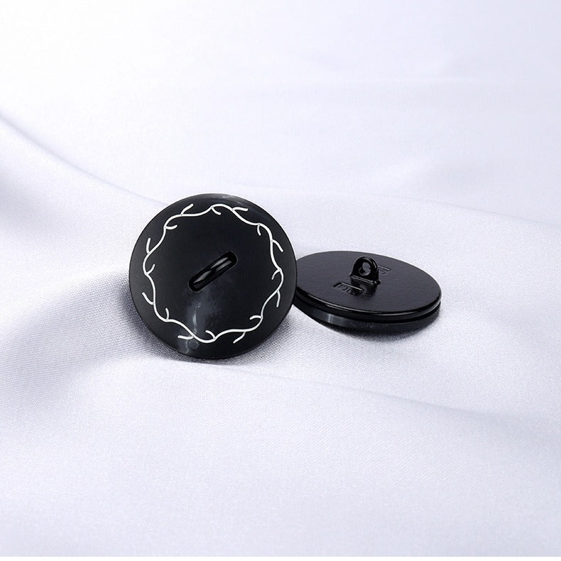 18–25mm two-tone shank buttons, dark base with white trim, pair view