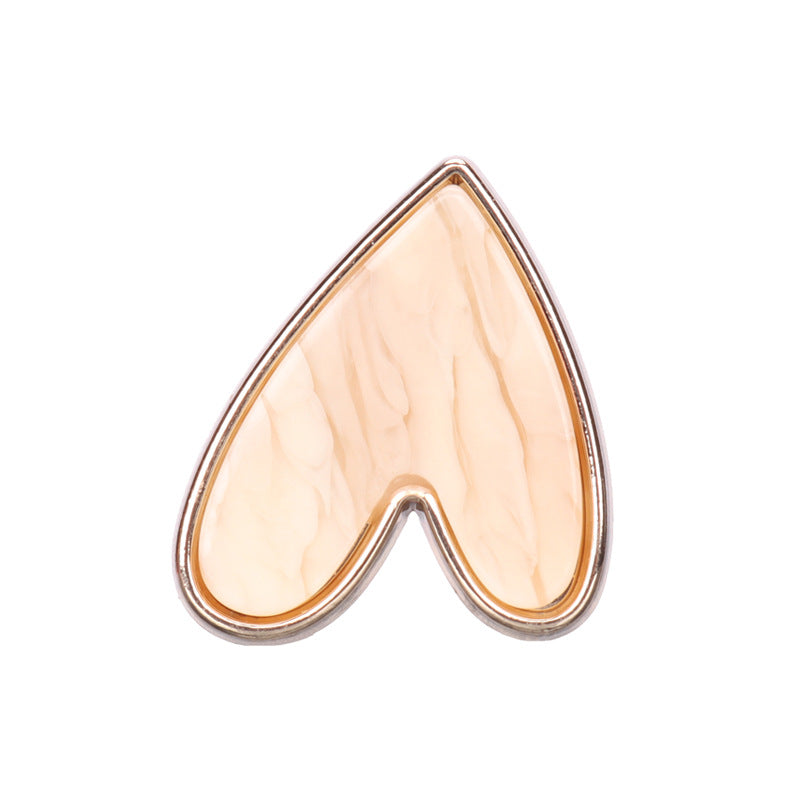 Heart-shaped metal shank button, beige front with rose-gold rim detail