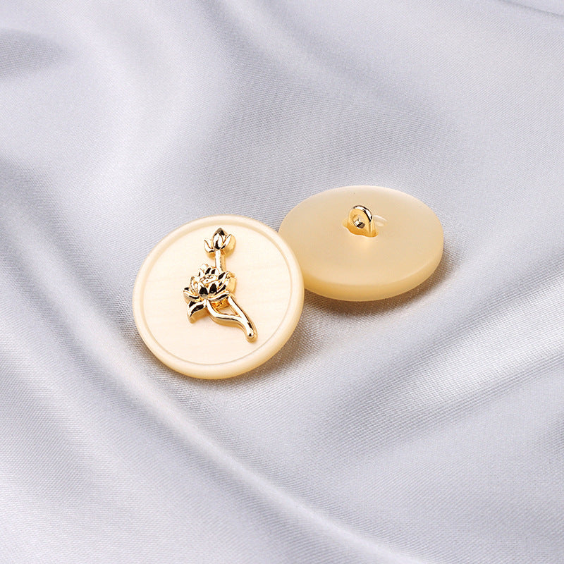 Beige round resin buttons with gold-tone floral rose design and shanks