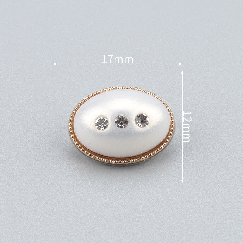 17mm oval pearl-look button with gold bezel and three clear rhinestones