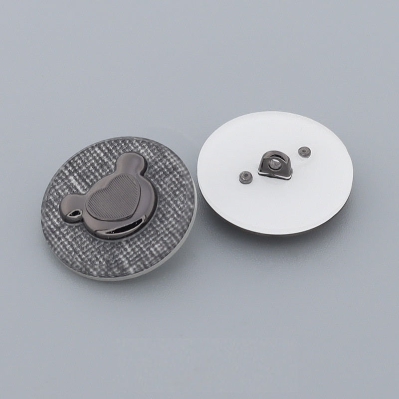 Bear-shaped metal shank button front and reverse view with gray bear inset