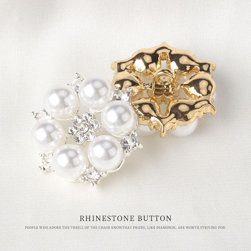 Gold-tone pearl rhinestone button with round faux pearls and a swirling metal frame