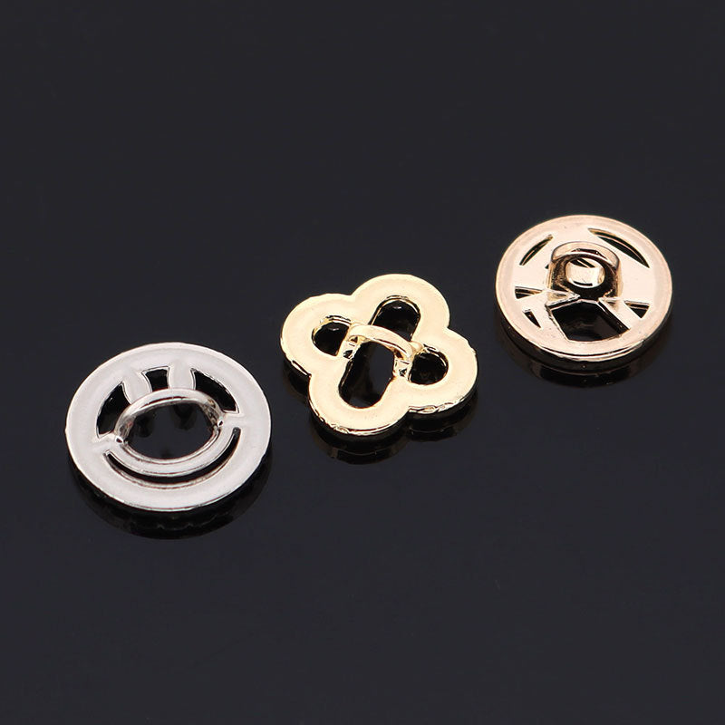 Gold and silver circular hollow buttons with rhinestone borders and a U-shaped core