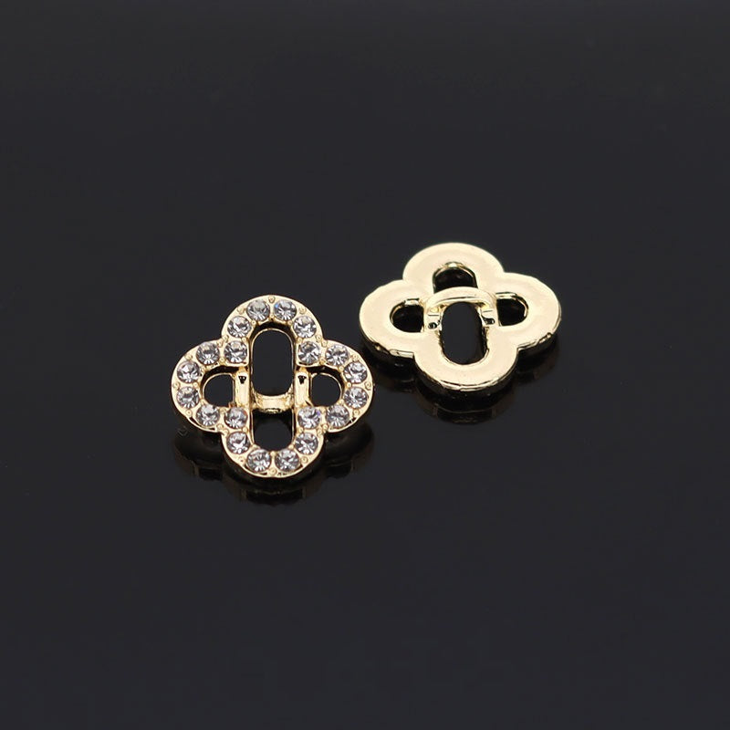 Gold and silver four-leaf clover style hollow rhinestone button, circular metal frame