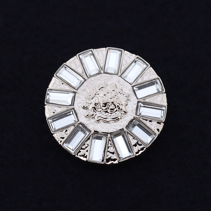 Round coat button, silver-tone metal with crystal rhinestones and engraved lion medallion