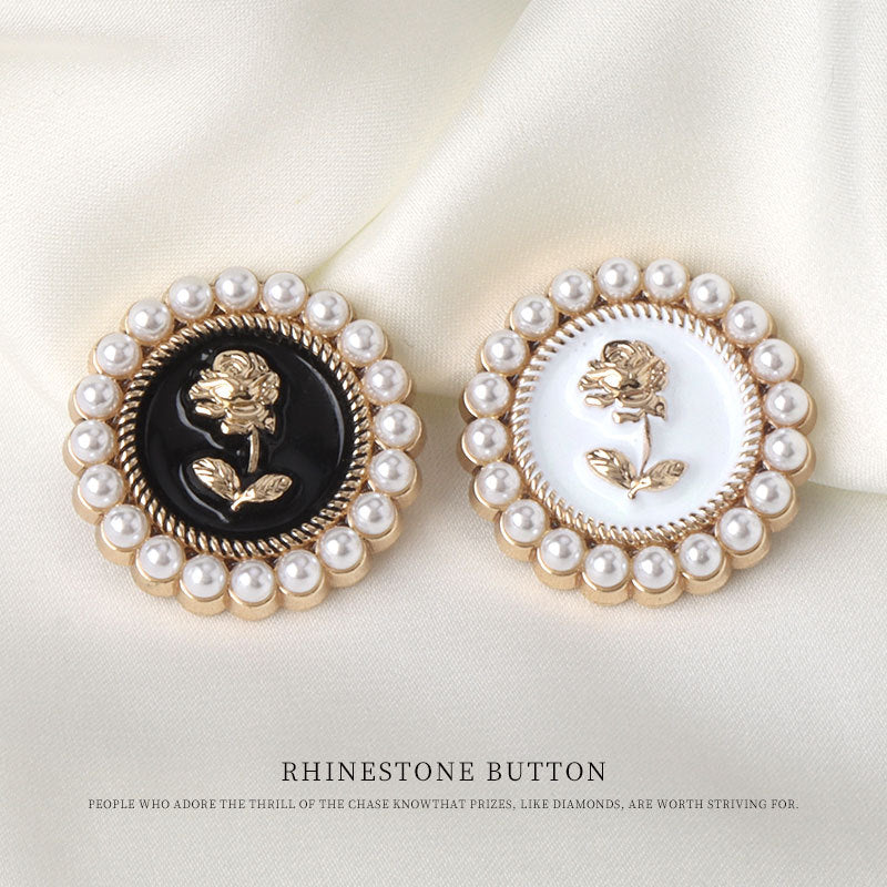 Pearl rose metal buttons: one black center, one white center, gold trim