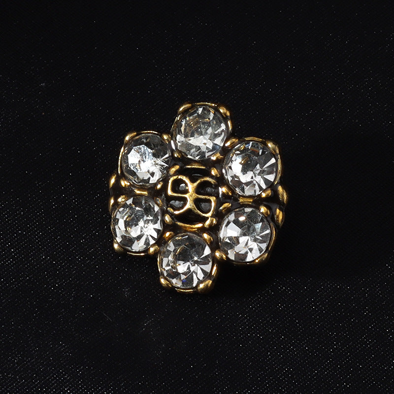 Rhinestone shank button, clear round crystals with gold-tone ornate metal frame