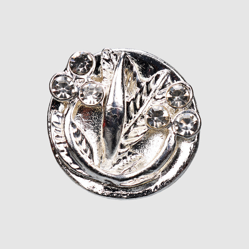 Round silver-tone rhinestone metal shank button with leaf design and crystal studs, 21mm