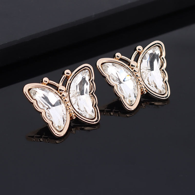 Butterfly metal rhinestone shank button, clear faceted stones, rose-gold tone frame