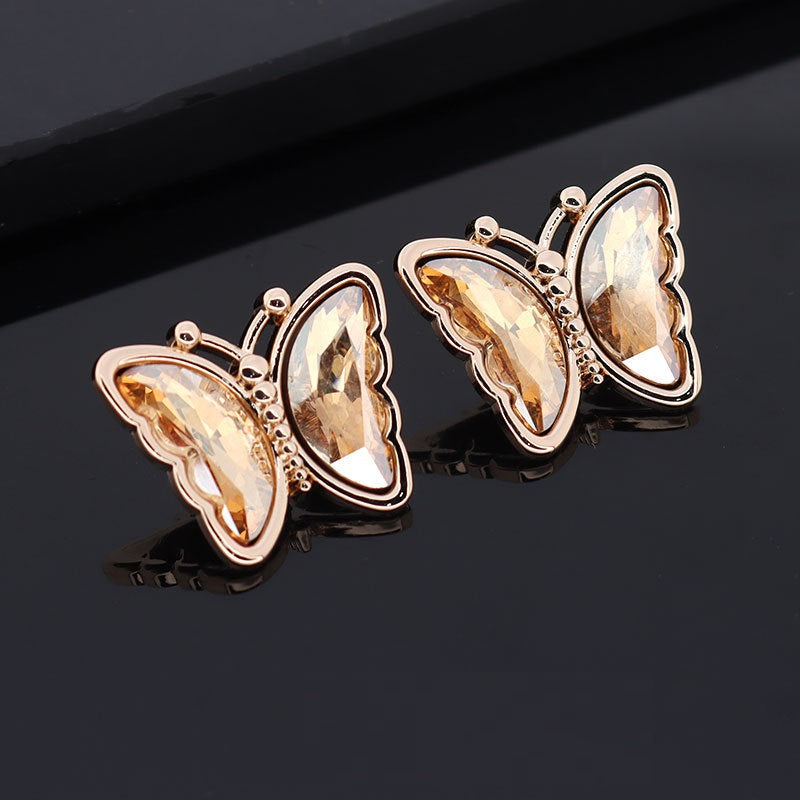 Butterfly metal rhinestone shank buttons, amber/golden stones, rose-gold tone frames