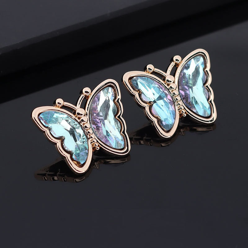Butterfly metal rhinestone shank buttons, light blue and prismatic stones, rose-gold tone