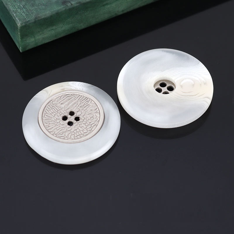 Resin coat button, white finish with textured silver metal 4-hole center, 16–25mm.