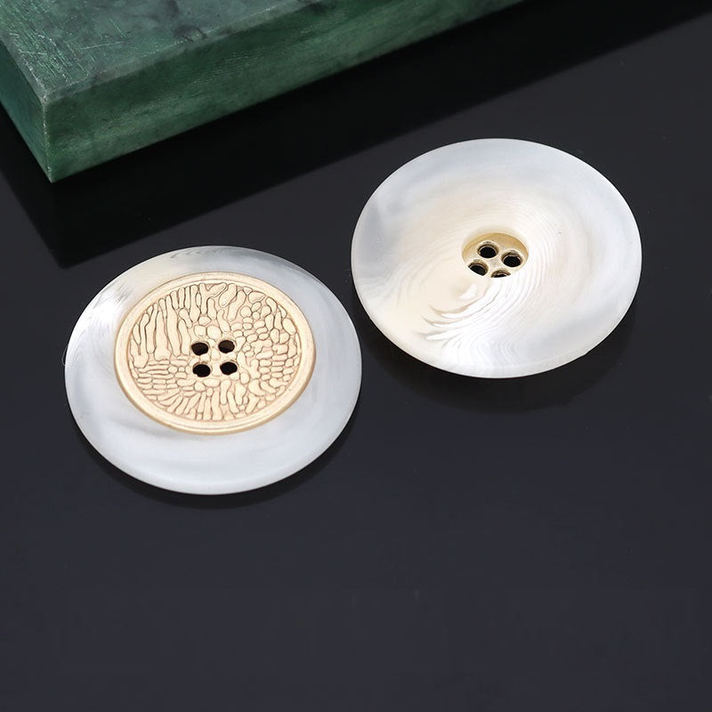 Resin coat button, white finish with textured gold metal 4-hole center, 16–25mm.
