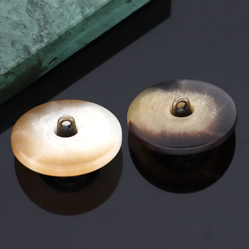 Beige and brown rabbit head shank button backs with metal loop shank