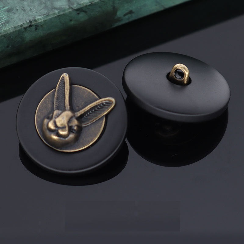 Black rabbit head shank button front with metal loop, paired with back