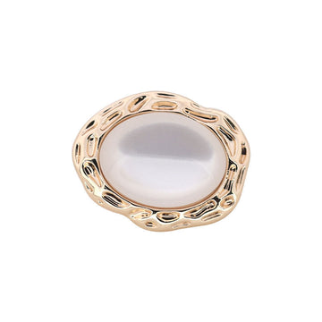 Irregular white resin button with gold metal shank, ornate oval frame