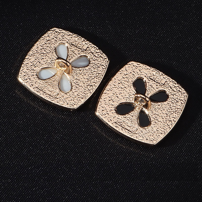 Back view: square metal buttons with shanks and 4-hole attachment points