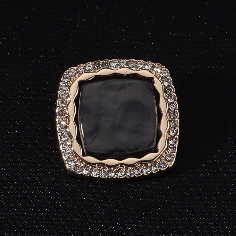 Black square diamond-studded metal button with shank