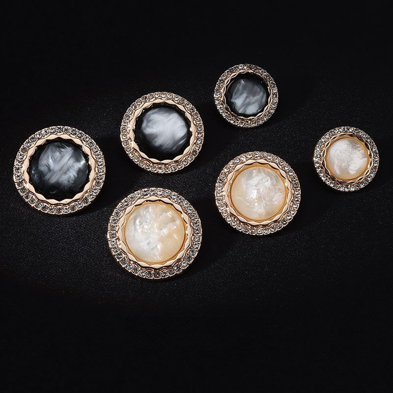 Mixed white and black shank buttons, gold rim with clear rhinestone borders, assorted sizes