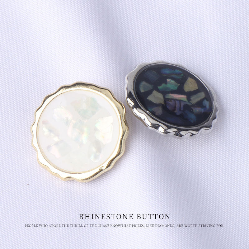 Abalone shell button pair: iridescent white and dark blue-green with metal rim