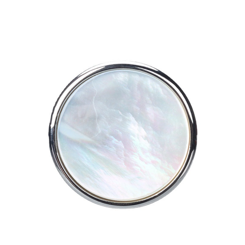 Round mother-of-pearl jacket button with shiny silver metal rim