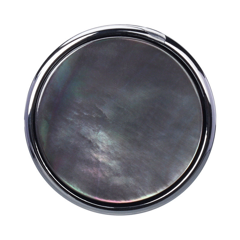 Natural black shell button with metal shank, glossy round face